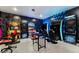 Entertainment room featuring multiple game stations and gaming chairs at 1041 Castle Pines Ct, Reunion, FL 34747