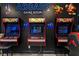 Vibrant arcade game room featuring classic arcade machines and playful character accents on the wall at 1041 Castle Pines Ct, Reunion, FL 34747