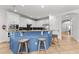 Open kitchen design with breakfast bar and stainless steel appliances at 1041 Castle Pines Ct, Reunion, FL 34747