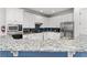 Modern kitchen featuring stainless steel appliances, granite countertops, and stylish cabinetry at 1041 Castle Pines Ct, Reunion, FL 34747