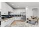 Modern kitchen features stainless steel appliances, granite countertops, and ample cabinet space at 1041 Castle Pines Ct, Reunion, FL 34747