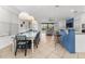 Bright, open living area with modern furnishings that transitions between the dining, kitchen, and living room at 1041 Castle Pines Ct, Reunion, FL 34747