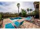 Sparkling pool with lounge chairs, a nearby palm tree, and plenty of patio space at 1041 Castle Pines Ct, Reunion, FL 34747
