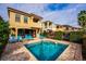 Beautiful backyard pool area with lounge chairs, pavers, and well-maintained landscaping at 1041 Castle Pines Ct, Reunion, FL 34747