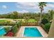 Inviting private pool with manicured landscaping and golf course views nearby at 1041 Castle Pines Ct, Reunion, FL 34747