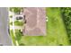 Birds eye view of home showing roof, lawn, driveway and close proximity to a nearby street at 10656 Savannah Plantation Ct, Orlando, FL 32832