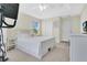 Comfortable bedroom featuring a ceiling fan and a bright window at 10656 Savannah Plantation Ct, Orlando, FL 32832