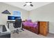 Bedroom with large monitor and a bed with built in drawers at 10656 Savannah Plantation Ct, Orlando, FL 32832