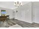 Inviting entryway featuring gray floors, white doors, a vintage piano, and modern decor, creating a stylish welcome at 10656 Savannah Plantation Ct, Orlando, FL 32832