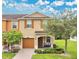 Charming two-story home with a well-maintained front yard, covered entrance, and attached garage at 10656 Savannah Plantation Ct, Orlando, FL 32832