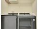 Modern laundry room featuring a new washer and dryer at 10656 Savannah Plantation Ct, Orlando, FL 32832