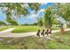 View of park with benches, shade trees, and sidewalks perfect for outdoor enjoyment at 10656 Savannah Plantation Ct, Orlando, FL 32832