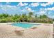 Outdoor pool area featuring lounge chairs with lush trees in the background at 10656 Savannah Plantation Ct, Orlando, FL 32832