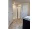 Bathroom with a walk-in shower, tile floors, and a modern vanity at 107 Athabasca Dr, Poinciana, FL 34759