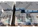 An aerial perspective showing the layout of roofs and screened-in pools in adjacent backyards at 1070 Splash Shot Pl, Davenport, FL 33896