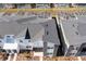 An aerial view highlighting the home's roof, landscaping, and screened-in pools in the backyards at 1070 Splash Shot Pl, Davenport, FL 33896