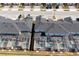 A high angle showcasing the roofs, screened-in pools, and street layout of this residential area at 1070 Splash Shot Pl, Davenport, FL 33896