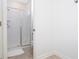 Clean bathroom featuring a glass-enclosed shower and neutral tile at 1070 Splash Shot Pl, Davenport, FL 33896