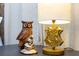 Close up of owl figurine and themed desk lamp in bedroom at 1070 Splash Shot Pl, Davenport, FL 33896