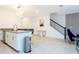 Modern kitchen featuring white cabinetry, stainless steel appliances, and a breakfast bar at 1070 Splash Shot Pl, Davenport, FL 33896