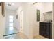 Convenient laundry room with modern black washer, dryer, and wire shelving at 1070 Splash Shot Pl, Davenport, FL 33896
