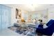 Bright living room with a large sectional sofa, stylish rug, and modern decor at 1070 Splash Shot Pl, Davenport, FL 33896