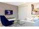 Comfortable living room featuring a modern TV, plush seating, and stylish design at 1070 Splash Shot Pl, Davenport, FL 33896