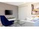 Cozy living room highlighting a large TV, modern decor, and inviting atmosphere at 1070 Splash Shot Pl, Davenport, FL 33896