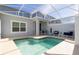 Inviting screened-in pool area with comfortable seating and stylish decor offers a relaxing outdoor retreat at 1070 Splash Shot Pl, Davenport, FL 33896