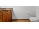 Clean bathroom featuring a toilet and a modern vanity with granite countertops at 150 E Robinson St # 1023, Orlando, FL 32801