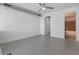 Spacious bedroom with neutral colors, ceiling fan, and en suite bathroom access at 150 E Robinson St # 1023, Orlando, FL 32801