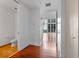 Bright hallway leading to the living area, showcasing hardwood floors and modern finishes at 150 E Robinson St # 1023, Orlando, FL 32801
