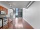 Modern kitchen with stainless steel appliances, spiral staircase, and an open layout at 150 E Robinson St # 1023, Orlando, FL 32801
