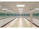 Spacious yoga studio with wood floors and floor to ceiling mirrors for exercise and wellness activities at 150 E Robinson St # 1023, Orlando, FL 32801