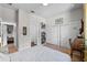 Well-lit bedroom featuring hardwood floors, multiple closets and an adjacent office space at 1536 Pine Island Rd, Kissimmee, FL 34744