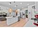 Spacious open concept kitchen, stainless steel appliances, breakfast bar, and view of the living area at 1536 Pine Island Rd, Kissimmee, FL 34744
