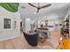 Bright and airy living room with an open floor plan leading to the kitchen and dining areas, with modern decor at 1536 Pine Island Rd, Kissimmee, FL 34744