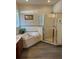 Bathroom showcasing double sinks, a walk-in shower, a soaking tub, and wood-look flooring at 160 Calabay Parc Blvd, Davenport, FL 33897