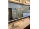 Elegant bathroom with double sinks, a large mirror, a walk-in shower, and a soaking tub at 160 Calabay Parc Blvd, Davenport, FL 33897