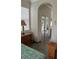 Comfortable bedroom with tile floors, mirrored closet, and en suite bathroom at 160 Calabay Parc Blvd, Davenport, FL 33897