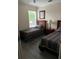Comfortable bedroom featuring two twin beds, natural light, and closet space at 160 Calabay Parc Blvd, Davenport, FL 33897