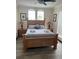 Comfortable bedroom showcasing neutral decor, a ceiling fan, and stylish lamps on the nightstands at 160 Calabay Parc Blvd, Davenport, FL 33897