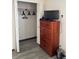 Bedroom closet providing ample space and clothing racks adjacent to wooden dresser at 160 Calabay Parc Blvd, Davenport, FL 33897
