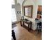 Welcoming entryway with elegant console table and convenient access to the kitchen at 160 Calabay Parc Blvd, Davenport, FL 33897