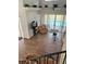 Bright living room boasts tile floors and sliding glass doors leading to the pool at 160 Calabay Parc Blvd, Davenport, FL 33897