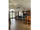 Open-concept living space boasts tile floors, dining area, and kitchen with breakfast bar at 160 Calabay Parc Blvd, Davenport, FL 33897