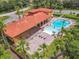 Community clubhouse with a pool, patio, and pergola provides residents with a resort-style experience at 169 Verde Way, Debary, FL 32713