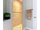 Bathroom featuring a tile shower with a decorative accent, and a towel bar at 169 Verde Way, Debary, FL 32713