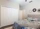 Cozy bedroom featuring a plush bed, soft lighting, and ample closet space for storage at 169 Verde Way, Debary, FL 32713