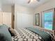 Bedroom with neutral walls, ceiling fan, window, and closet showcasing a calm and relaxing atmosphere at 169 Verde Way, Debary, FL 32713